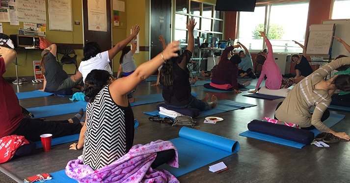 ALMA participants practice yoga at Casa Latina.