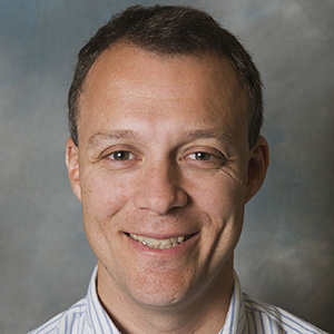 Headshot portrait of Dr. John Amory, reproduction and contraception.