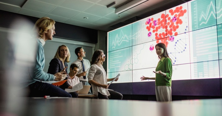 group discusses a scientific presentation