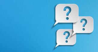 Question marks and speech bubbles with copy space on blue background